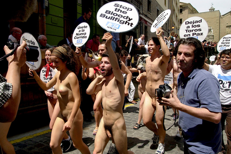 Animal rights protesters march on July 5, 2002, in Pamplona against annual bull fighting and running of the bulls that will be celebrated from July 7th until July 14th during the San Fermin Festival festivities, Basque Country. On each day of the eight San Fermin festival days six bulls are released at 8:00 a.m. (0600 GMT) to run from their corral through the narrow, cobbled streets of the old navarre town over an 850-meter (yard) course. Ahead of them are the runners, who try to stay close to the bulls without falling over or being gored. The demonstration was organized by the pro animal and anti bullfighting association People for the Ethical Treatment of Animals (PETA). (Ander Gillenea / Bostok Photo)